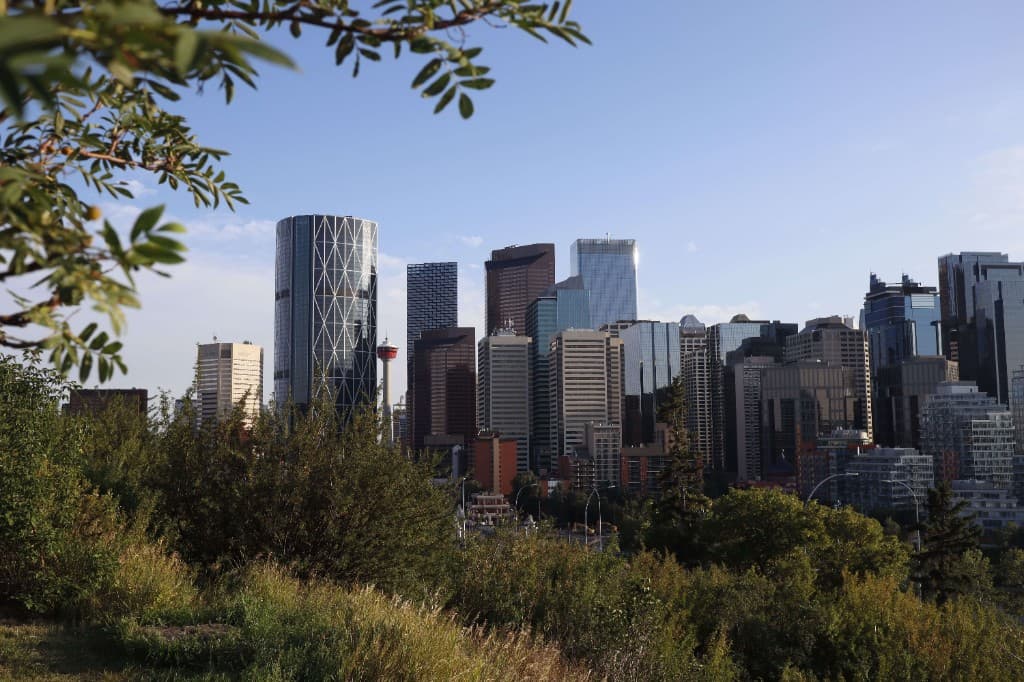 Calgary downtown skyline with The Bow and the Calgary Tower, seen from a hillside
