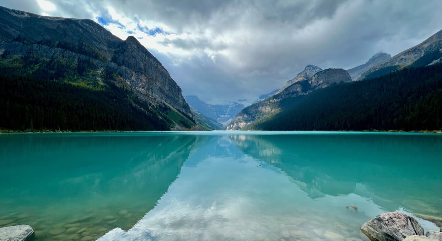 Turquoise water at Lake Louise in Banff National Park, about an hour from Calgary, with the Rockies reflected in the lake