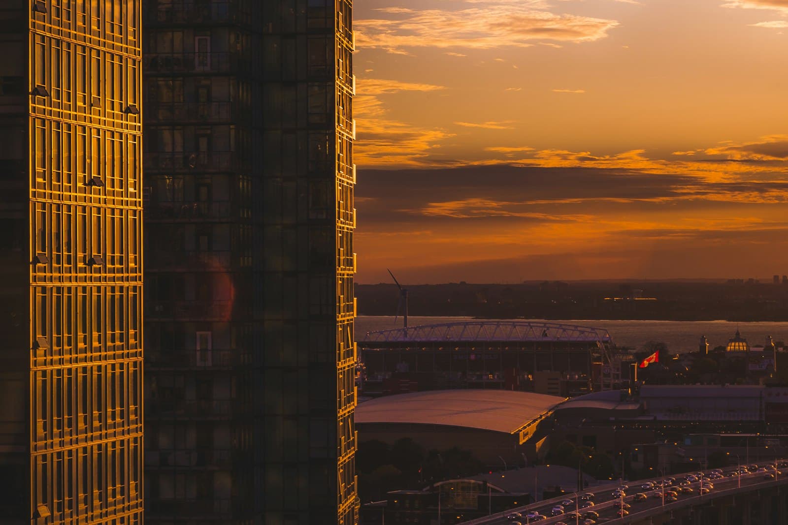 Toronto condo towers at sunset overlooking BMO Field, Exhibition Place, and the Gardiner Expressway
