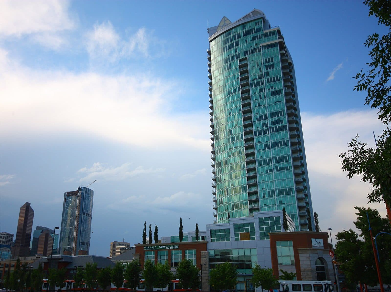 The teal glass Arriva condo tower in Victoria Park, Calgary