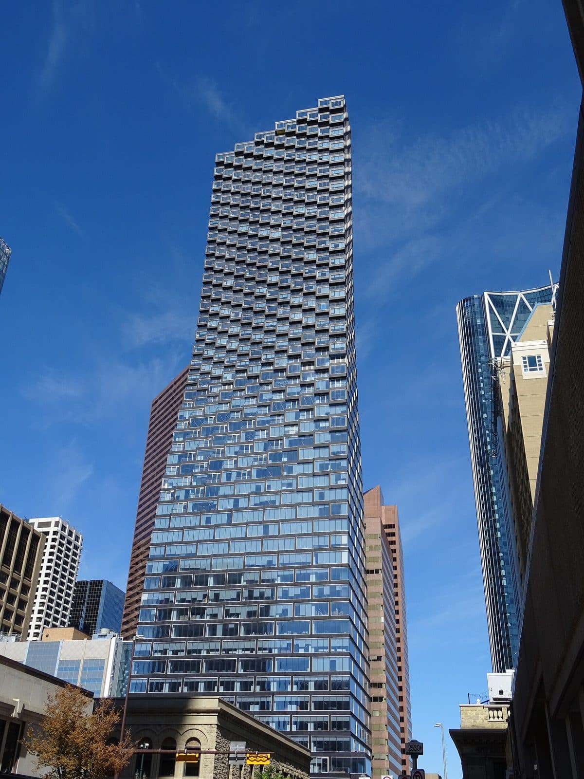TELUS Sky seen from street level against a blue sky