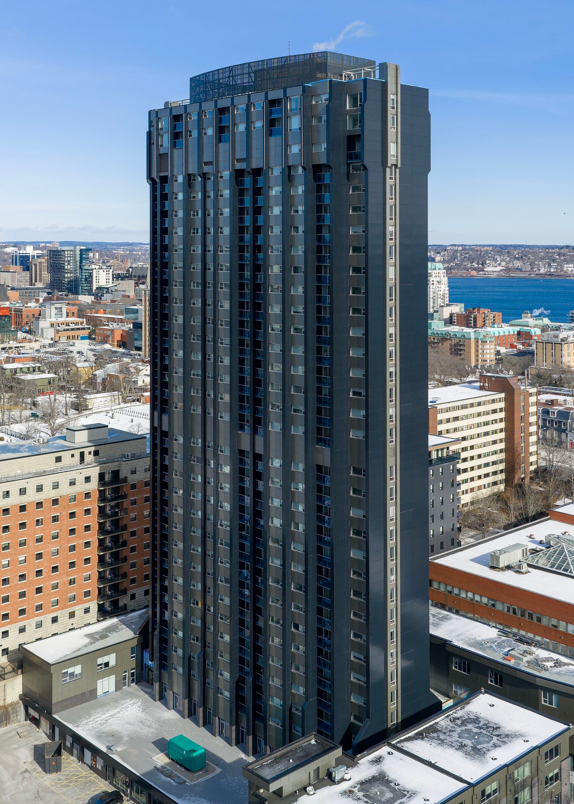 The Vüze, a tall concrete apartment tower in Halifax's South End, seen from the south