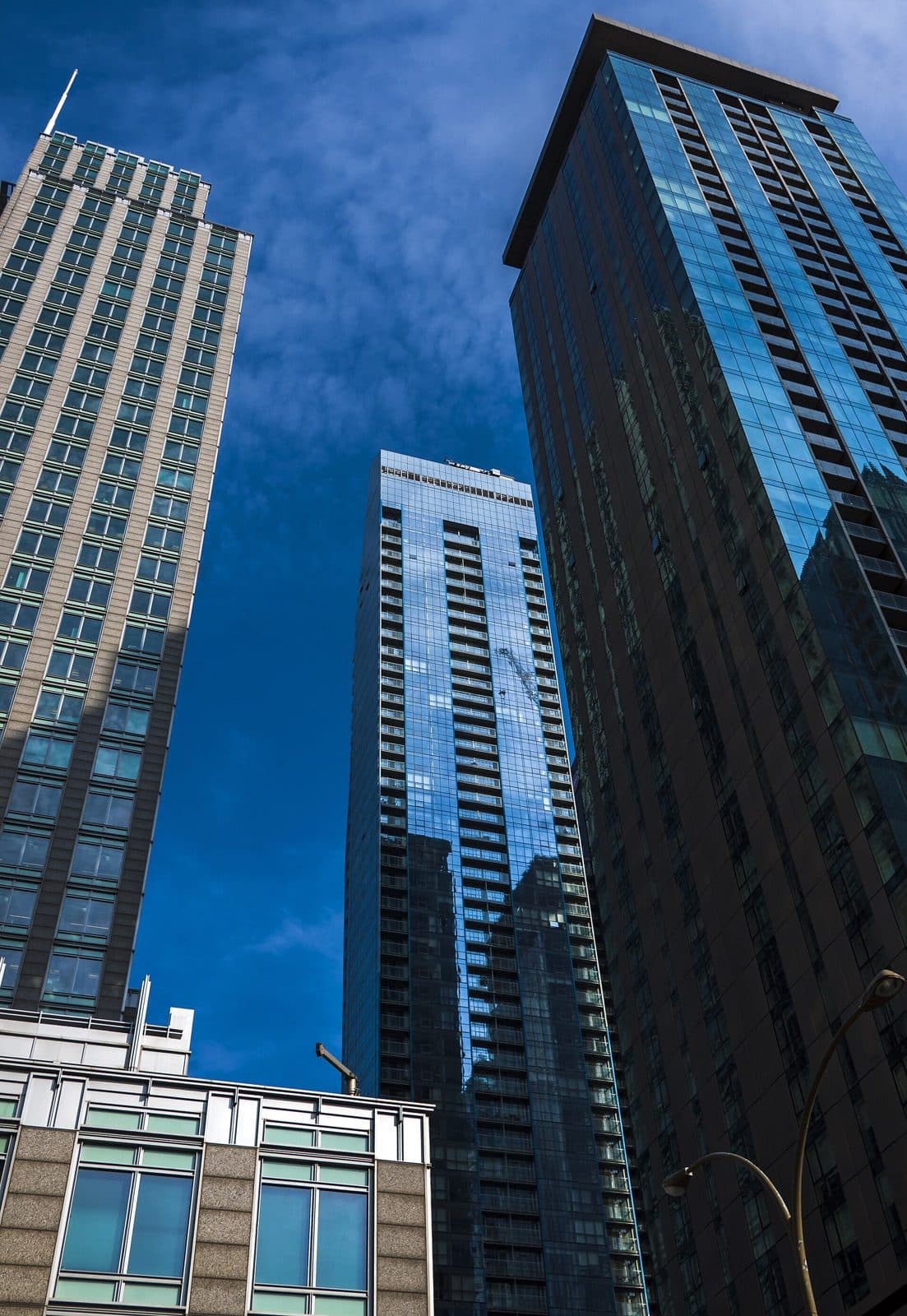 Three downtown towers including L'Avenue seen from street level