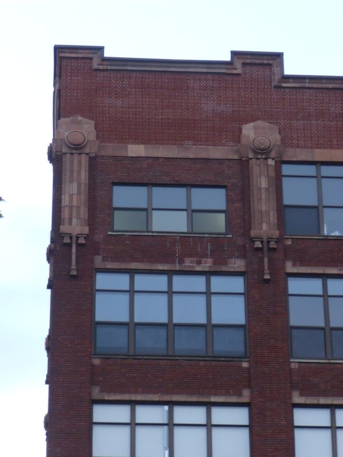 Brick facade and stone details of the former Northern Electric building