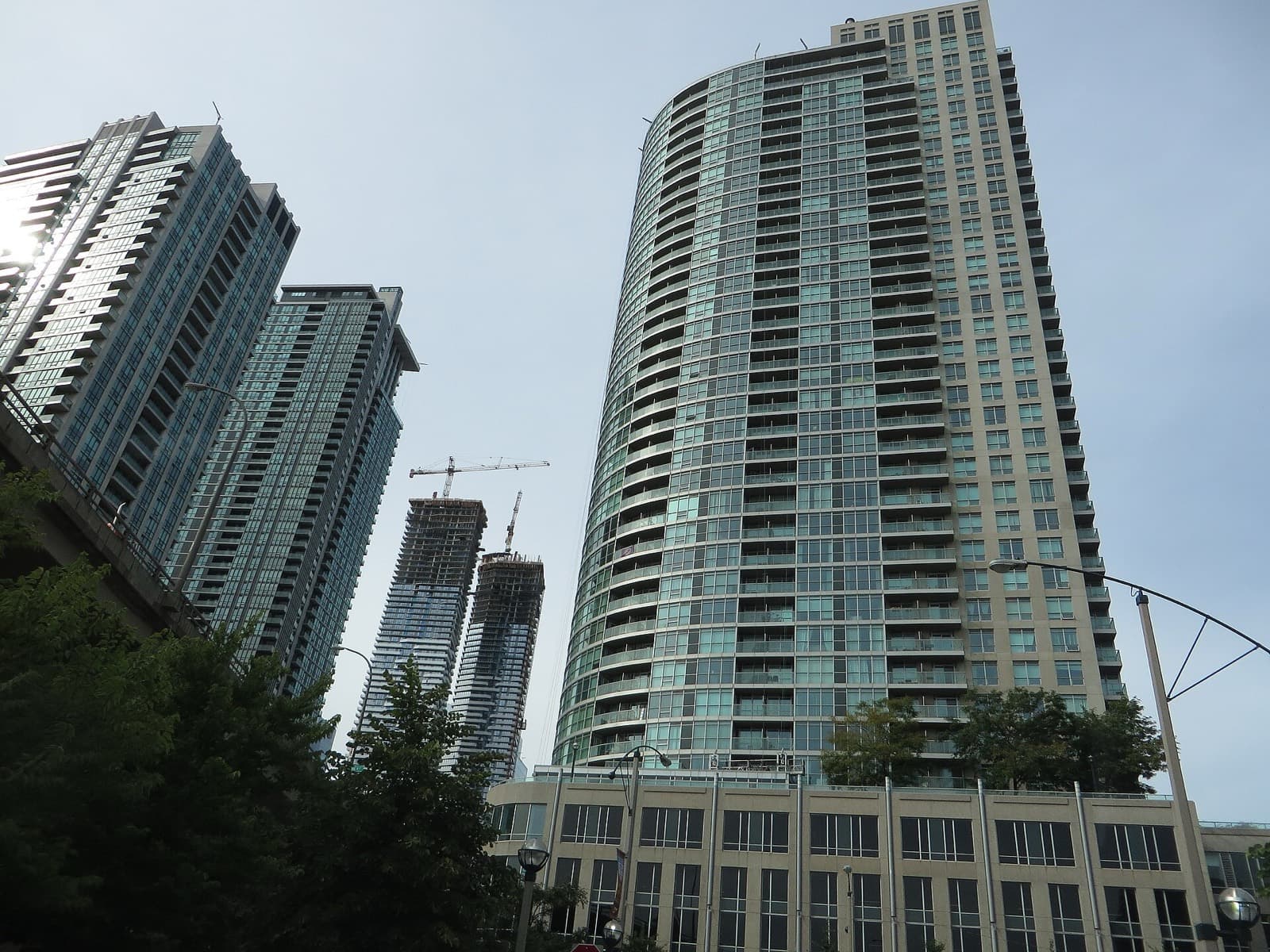 A curved Pinnacle Centre condo tower seen from Yonge Street