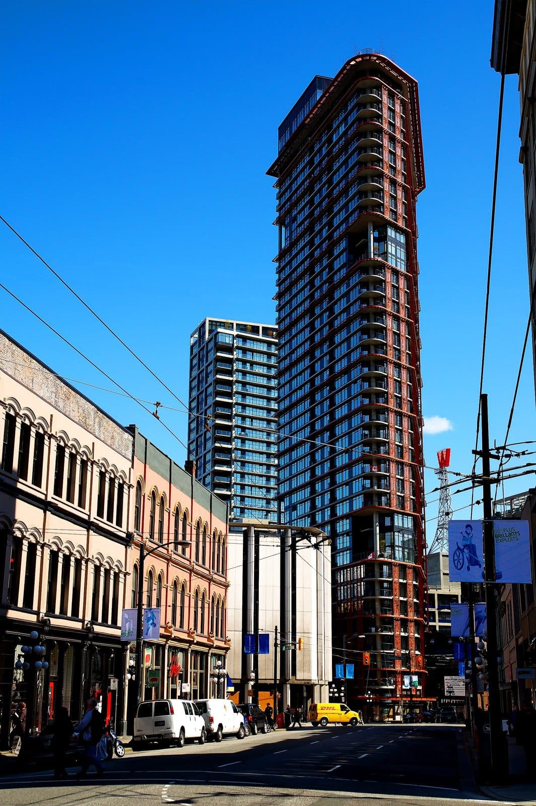 Woodward's W43 tower rising above the heritage buildings of West Cordova Street in Gastown