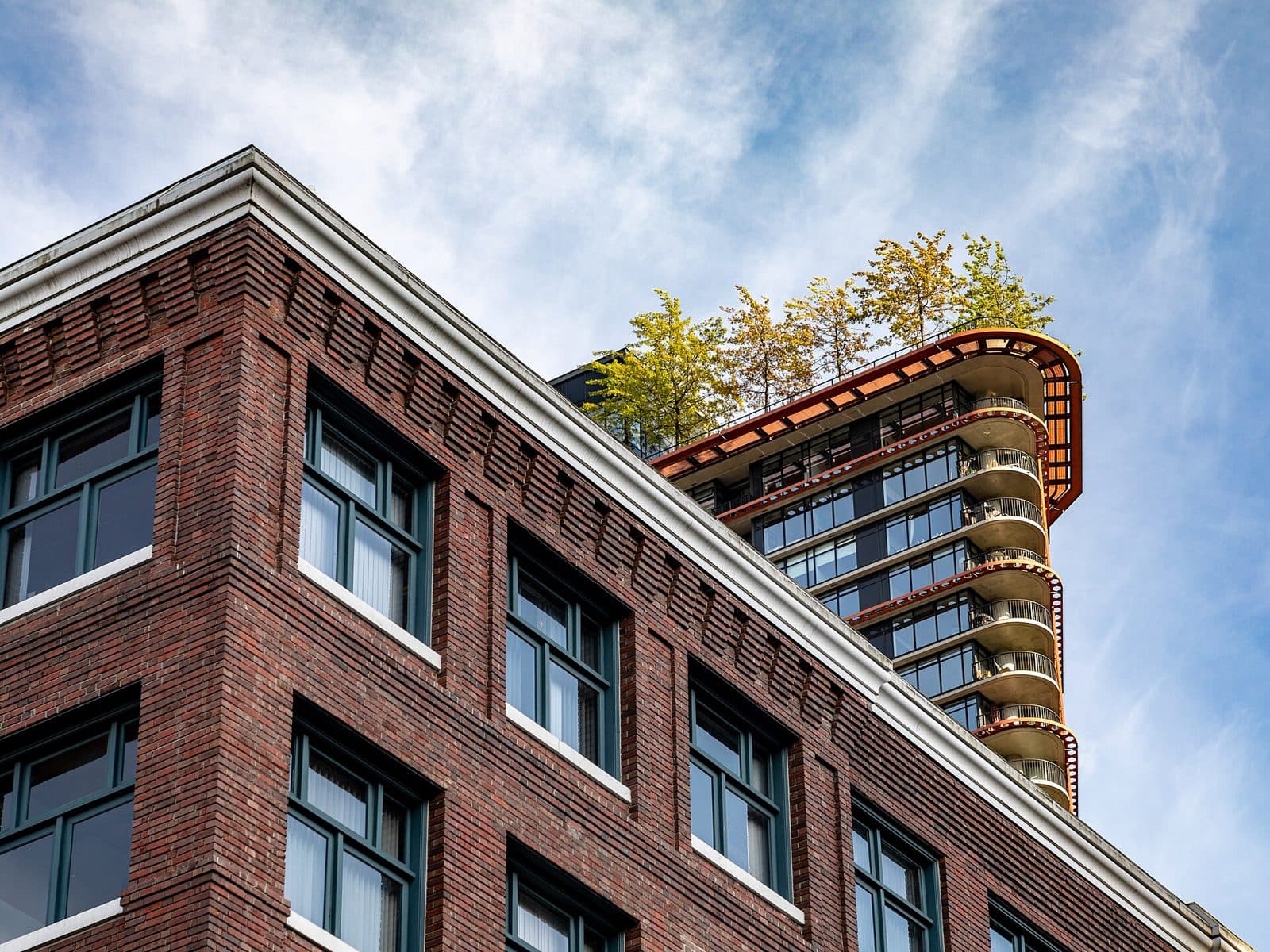 Top floors of Woodward's 43 behind a brick Gastown building