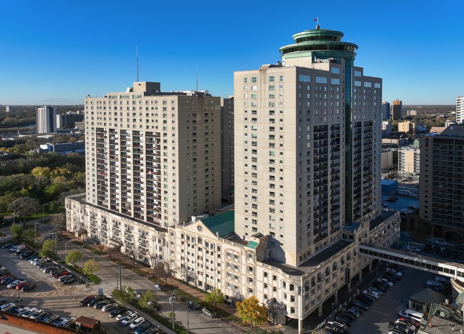 The three towers of Fort Garry Place with the green dome of the revolving restaurant