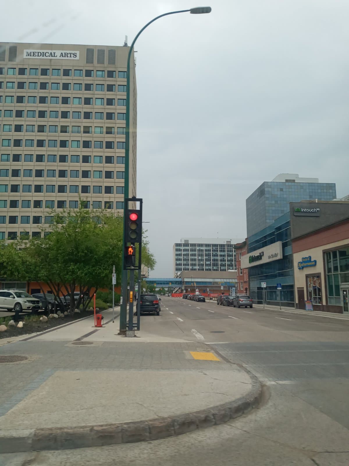 The Medical Arts Building on Kennedy Street with its rooftop sign, seen from the corner